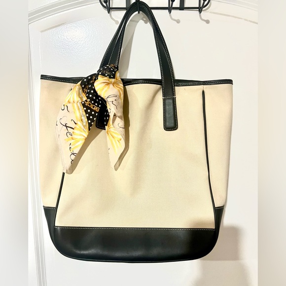 Coach Handbags - Coach cream canvas tote with navy leather trim.  VGUC